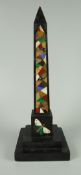 NINETEENTH CENTURY DERBYSHIRE BLACK MARBLE OBELISK having inlaid patchwork or scrapwork column above