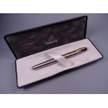 A MODERN (2001-2004) STAINLESS STEEL PARKER INFLECTION FLIGHTER FOUNTAIN PEN with gold plated trim &