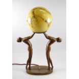 A GOOD ART DECO FIGURAL TABLE LAMP composed of two nimble females standing with globular marbled