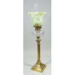 AN ANTIQUE BRASS OIL LAMP with twist-style column on a stepped base, cut-glass reservoir &