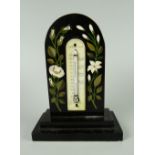 NINETEENTH CENTURY BLACK MARBLE ARCH TOPPED DESK THERMOMETER inlaid with floral sprays, raised on