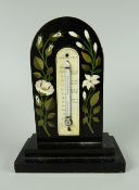 NINETEENTH CENTURY BLACK MARBLE ARCH TOPPED DESK THERMOMETER inlaid with floral sprays, raised on