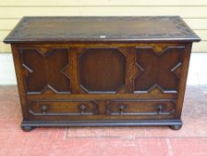 AN EARLY 20th CENTURY CARVED OAK MULE CHEST, 73.5 cms high, 122.5 cms wide, 51.5 cms deep