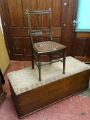 AN ANTIQUE SCUMBLED PINE BLANKET CHEST with upholstered pad top and raised on castors, 48 cms