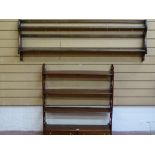 AN ERCOL STYLE WALL RACK and a reproduction mahogany four shelf display rack with twin lower