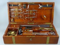 A VICTORIAN MAHOGANY FIELD SURGEON & AMPUTATION KIT by S Thistlewaite & Co, brass bound case with