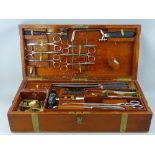 A VICTORIAN MAHOGANY FIELD SURGEON & AMPUTATION KIT by S Thistlewaite & Co, brass bound case with