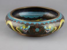 A GOOD CHINESE CLOISONNE DRAGON BOWL, 25 cms diameter, depicting five toed dragons chasing flaming
