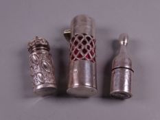 A SILVER & RUBY GLASS PERFUME CONTAINER, the body with lattice work and with a hinged lid (no