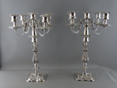 A GOOD LARGE PAIR OF SILVER PLATED FOUR BRANCH TABLE CANDELABRA, 45.5 cms high