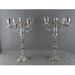 A GOOD LARGE PAIR OF SILVER PLATED FOUR BRANCH TABLE CANDELABRA, 45.5 cms high