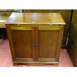 A VINTAGE MAHOGANY TWO DOOR CABINET with top brushing slide, 92 cms high, 92 cms wide, 48.5 cms