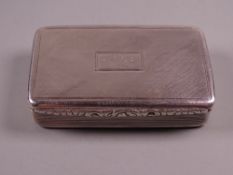 A HEAVY OBLONG SILVER SNUFF BOX, the hinged lid having scrolled decoration to the front edge and
