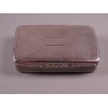 A HEAVY OBLONG SILVER SNUFF BOX, the hinged lid having scrolled decoration to the front edge and