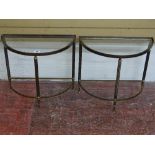 A PAIR OF MID 20th CENTURY BRASS SEMI-CIRCULAR OCCASIONAL TABLES with glass inset tops, 44 cms high,