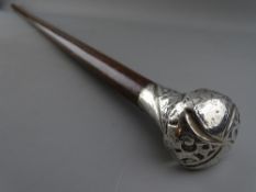 A VINTAGE EXOTIC HARDWOOD WALKING CANE with substantial silver top, 91.5 cms long
