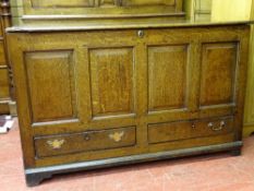 A LATE 18th CENTURY OAK MULE CHEST with joined oak four panel front and twin lower drawers, oak