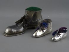 THREE NOVELTY BOOT PIN CUSHIONS, two silver, Birmingham 1907 and 1909, makers Levi & Salaman, 5.5