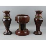 A VICTORIAN CORNISH SERPENTINE STONE FONT and a pair of baluster vases, 18.5 cms and 22.5 cms high