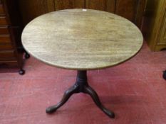 A GEORGIAN MAHOGANY TILT TOP TRIPOD TABLE, 73 cms high, 81 cms diameter the top