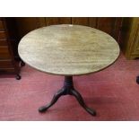 A GEORGIAN MAHOGANY TILT TOP TRIPOD TABLE, 73 cms high, 81 cms diameter the top