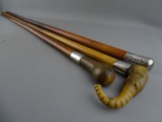 THREE VINTAGE MALACCA WALKING CANES, two horn topped examples, one carved in the form of an