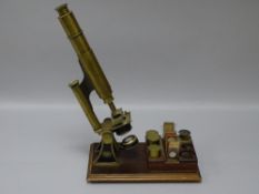 A SMITH & BECK, LONDON COMPOUND MONOCULAR MICROSCOPE, brass and black enamelled, no. 2361 with
