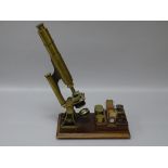 A SMITH & BECK, LONDON COMPOUND MONOCULAR MICROSCOPE, brass and black enamelled, no. 2361 with