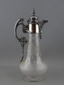 A VICTORIAN CLARET JUG with wheel cut decoration and plated metal mounts, 30.5 cms high overall
