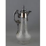 A VICTORIAN CLARET JUG with wheel cut decoration and plated metal mounts, 30.5 cms high overall