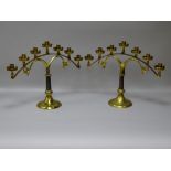 A GOOD PAIR OF VINTAGE BRASS ALTAR CANDELABRA, the circular bases with memorial inscription for