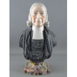 A STAFFORDSHIRE POTTERY BUST OF REVEREND JOHN WESLEY with raised plaque to the rear on a mottled