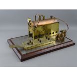 A SCRATCH BUILT LIVE STEAM HORIZONTAL STATIONARY ENGINE with copper boiler and pressure gauge,