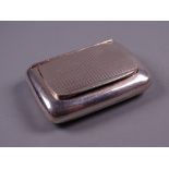 AN OBLONG SILVER SNUFF BOX with engine turned hinged lid, Birmingham 1930 by Charles Usher