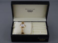 AN ACCURIST NINE CARAT GOLD LADY'S BRACELET WRISTWATCH in original box with instructions and