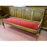A WELL COLOURED GEORGE III OAK OPEN SETTLE, the back with four shaped and crossbanded panels with