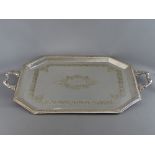 A LARGE TWO HANDLED RECTANGULAR ELECTROPLATE SERVING TRAY with reeded border and central