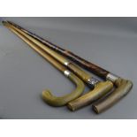 THREE HORN HANDLED WALKING STICKS with hallmarked silver collars, 92.5 cms the longest