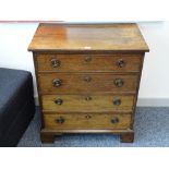 A NEAT MAHOGANY CHEST OF FOUR DRAWERS, oak lined with circular brass backplates and ring pull