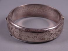 A BRIGHT CUT WIDE SILVER BANGLE, with birthday inscriptions, 1 troy oz, Chester 1951