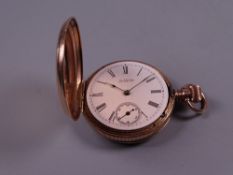 A LADY'S FOURTEEN CARAT GOLD ENCASED FOB WATCH with white enamel dial and sweep seconds dial, 1.8