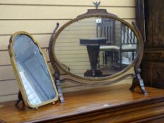 TWO VINTAGE DRESSING MIRRORS, a Regency style oval swing mirror on stand and a smaller easel stand