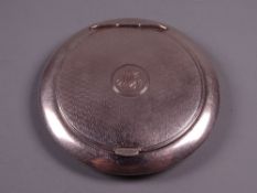 A CIRCULAR SILVER LADY'S POWDER COMPACT with engine turned lid and initials to the centre, 1.1
