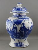 A LARGE CHINESE BLUE & WHITE PORCELAIN BALUSTER SHAPED STORAGE JAR & COVER, painted with figures