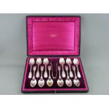 A GOOD CASED SET OF TWELVE LARGE SILVER TEASPOONS with tongs, fiddle thread and shell pattern by