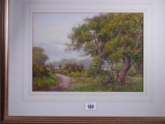 W G HUGHES watercolour - rural scene with wooded track and stile, signed and indistinctly titled and