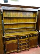 A 19th CENTURY ANGLESEY TALWRN OAK PINE & MAHOGANY DRESSER, the base cupboard doors with raised