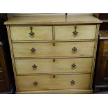 A LATE VICTORIAN BLONDE OAK CHEST of two short over three long drawers with slight Gothic