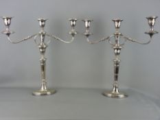 A GOOD PAIR OF ELECTROPLATE CLASSICALLY STYLED TWIN BRANCH CANDELABRA, 48 cms high overall