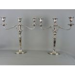 A GOOD PAIR OF ELECTROPLATE CLASSICALLY STYLED TWIN BRANCH CANDELABRA, 48 cms high overall